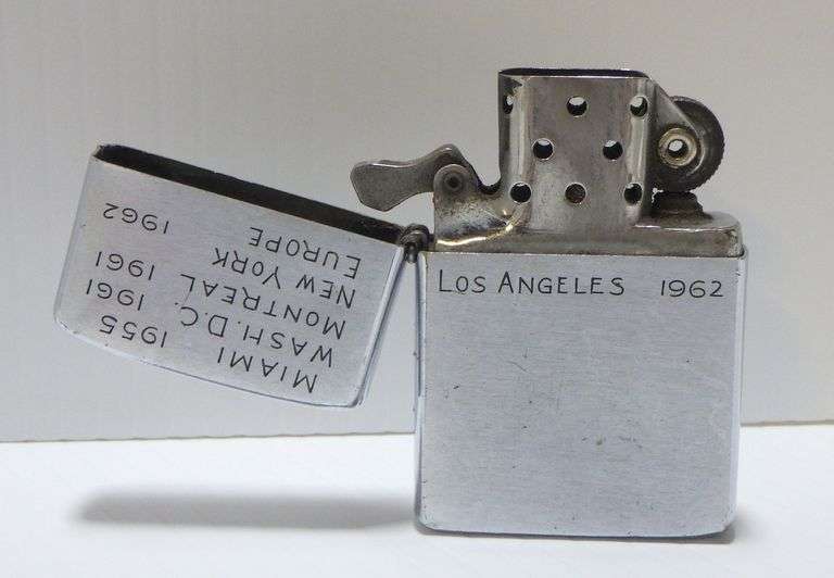 Older Zippo lighter with dates and cities engraved, used Albrecht