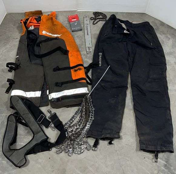 Husqvarna parts and chaps, used, worn; (8) Chainsaw chains, 14" bar and ...