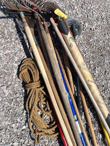 Assorted lawn tools, include: Broom rope, (2) Landscape rakes, Leaf ...