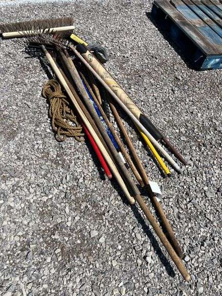 Assorted lawn tools, include: Broom rope, (2) Landscape rakes, Leaf ...