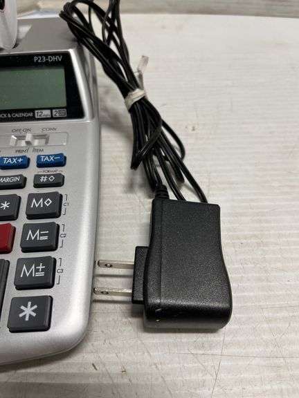 Small Canon adding machine, tape, cord, and standard adding machine ...