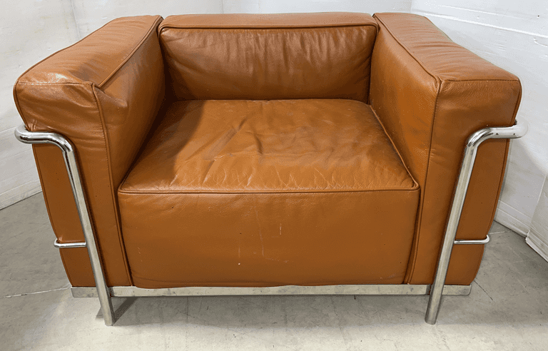Brown leather armchair, overall- 37"W x 27"D x 24"H, one arm has breakdown, some pitting to leather