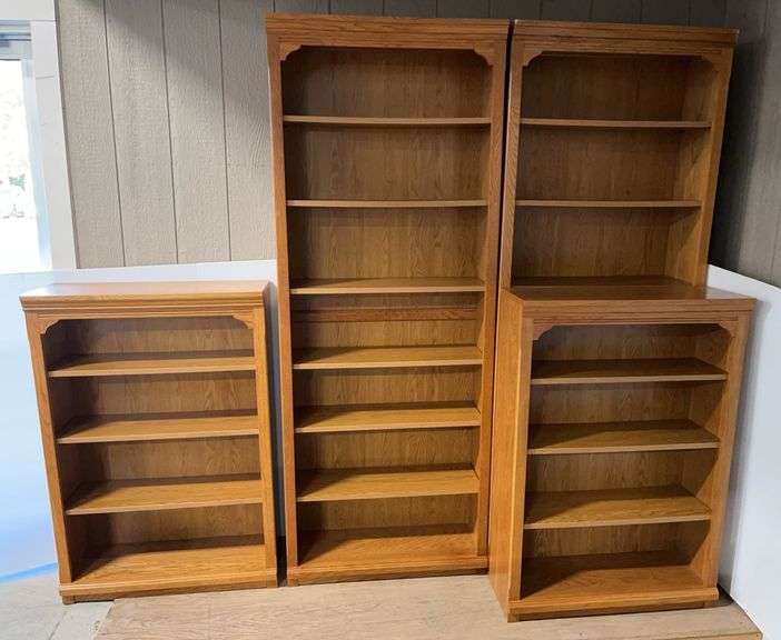 4-Piece bookshelf, small pieces- 7'H, tall pieces- 4'H, overall- 128"W x 12"D, great