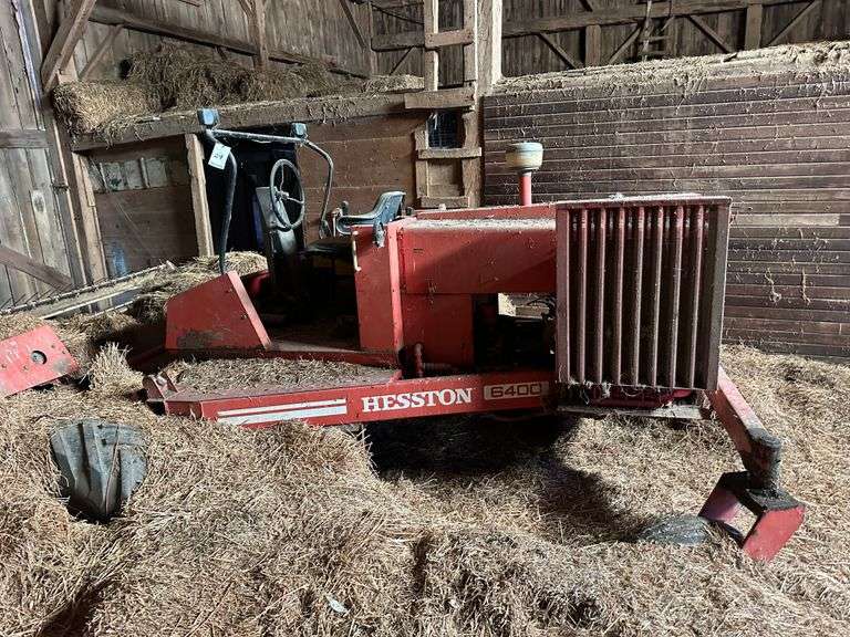 Hesston 6400 Self Propelled Windrower, As Is. Last known condition was the hydrostatic drive, head, sicklebar and conditioner all worked. Had a challenge getting the engine to start. NOTE: Buyer is responsible for the safe and timely removal of this item and for all equipment and tools required to move it. The auction company and estate will not provide assistance.