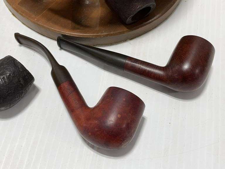 Pipe rack with several pipe tools, (10) pipes, 8-Briar, 1- Corn Cob, 1 ...