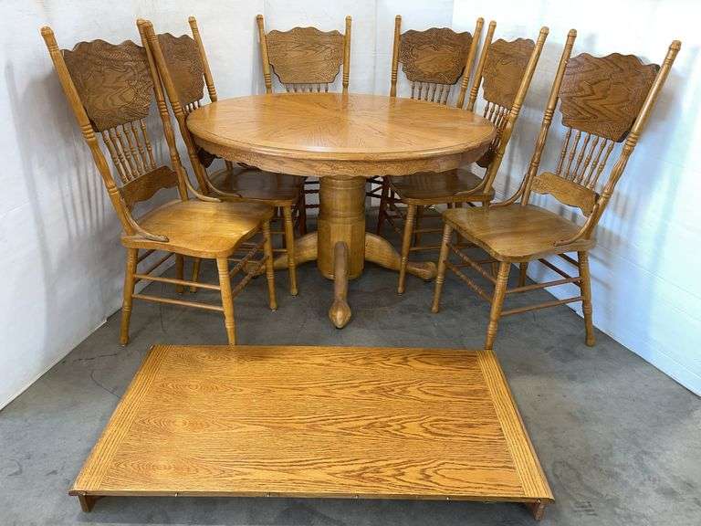 Oak grain dining table with 24" leaf, 48"Dia x 32"H; (6) Chairs, made in Taiwan, scrolling floral detailing