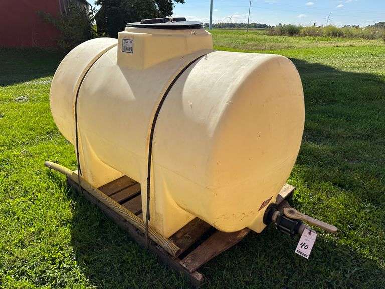 325 Gallon Poly Tank with Valve. Used to store a feed additive in silage as blown into silos (QLF possibly).