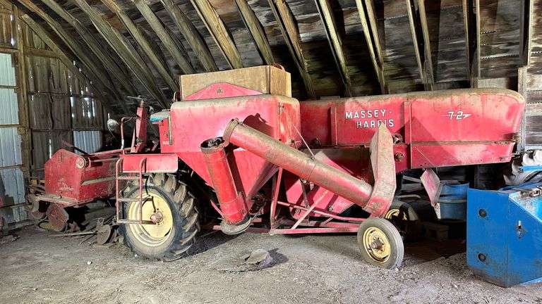Massey Harris 72 Combine with Grain and Pickup Head, As Is. Someone came to the farm within the last 20 years to work on this combine and get it running. It took the mechanic 15 minutes and it was running. The last time used in the fields is thought to be in the 1990s. NOTE: Buyer is responsible for the safe and timely removal of this item and for all equipment and tools required to move it. The auction company and estate will not provide assistance.