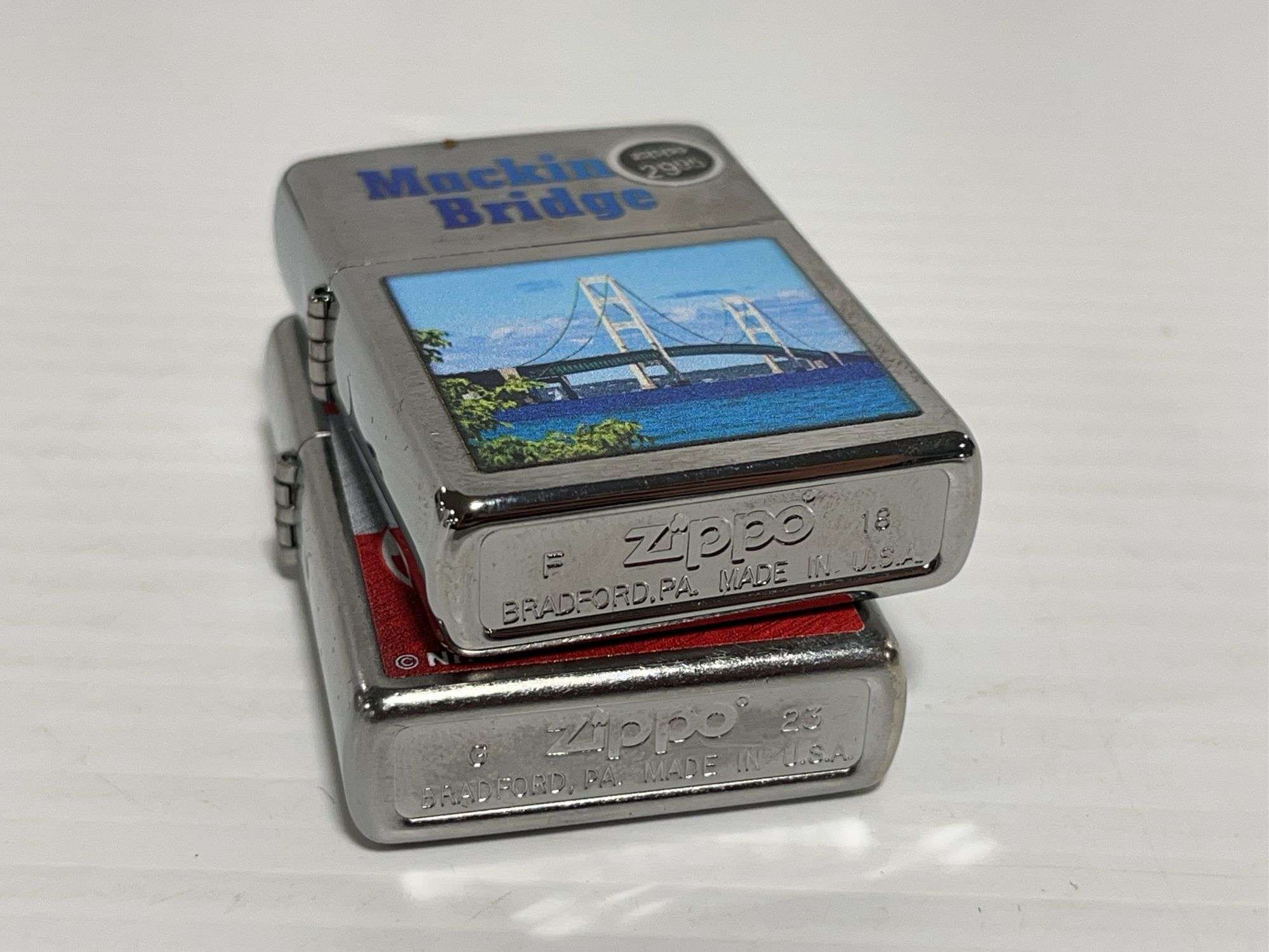 2) Zippo lighters: 1 - Detroit Red Wings, 1- Mackinac Bridge