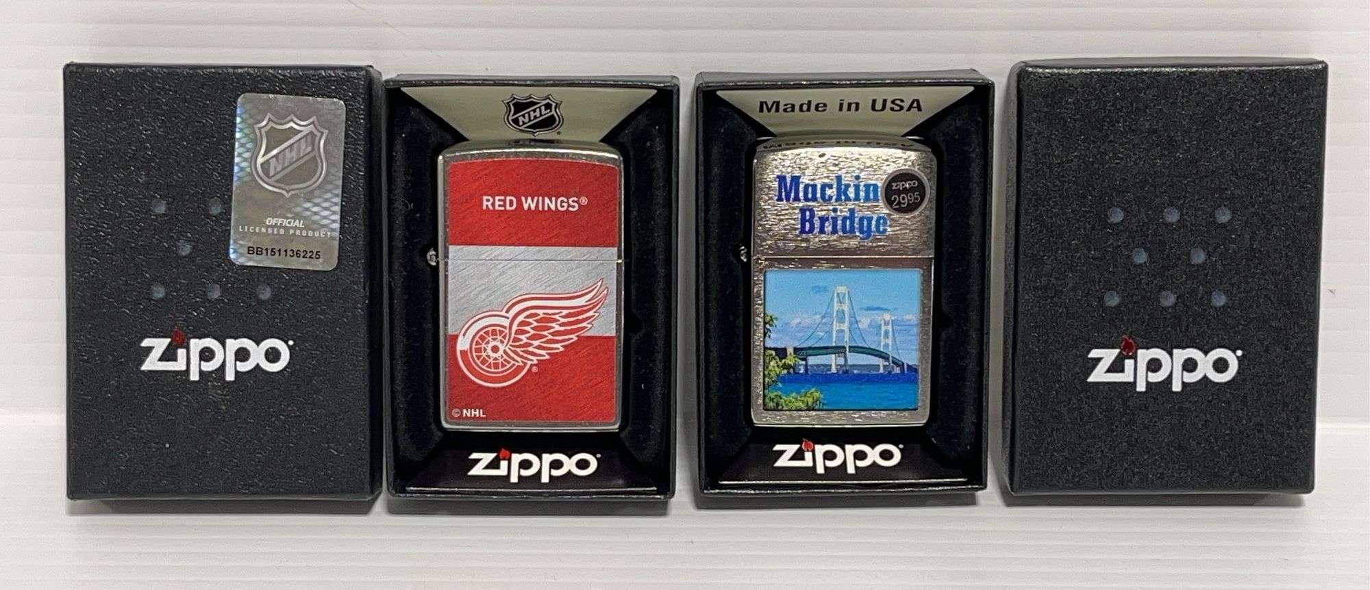 2) Zippo lighters: 1 - Detroit Red Wings, 1- Mackinac Bridge