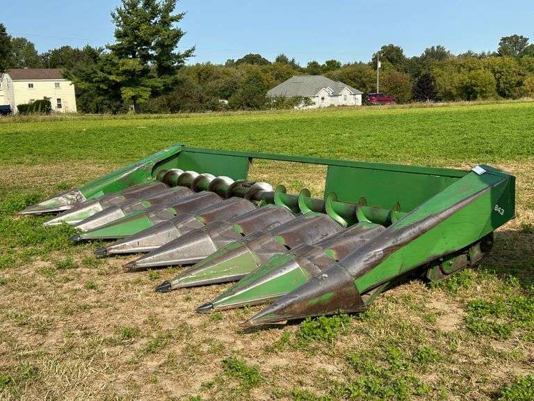 John Deere 843 Corn Head.  NOTE:  Prompt pick up of the head following the auction is requested so the Combine can be released to the buyer.