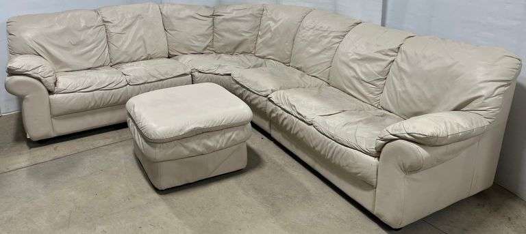 Three-piece leather sectional sofa and ottoman, straight piece- 46"L x 31"d x 34"H, curved- 62"L x 42"D x 34"H, end- 52"L x 31"D x 34"H, made in Italy