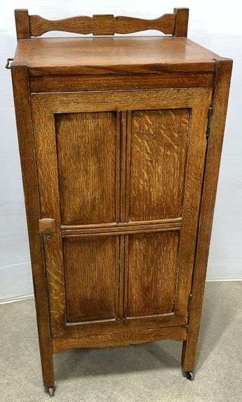 Antique dentist cabinet with pull-out tray shelves and compartments inside, 18"W x 15"D x 37 1/4"H with wheels, very good for age