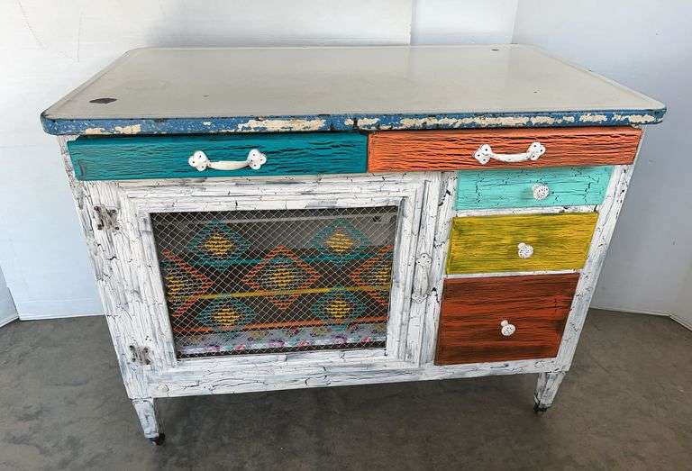Older cabinet on wheels, 5-drawer and 1-open door, ceramic top- 4 01/2"W x 25"D, base- 40 1/2" x 32 3/4"H, top has some chips, repainted, nice shape for age