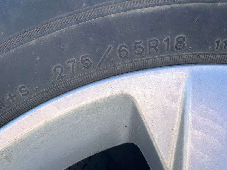 (4) Wrangler Goodyear 275/65R18 tires with rims - Albrecht Auction Service
