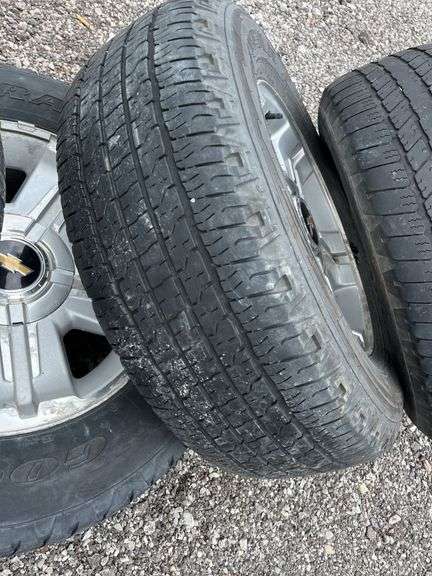 Set of (4) Factory P265/65R18 rims with tires, removed from a 2007 ...