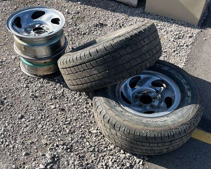 (2) 265/70 R16 tires and (4) Ford chrome rims, tires both hold air and ...