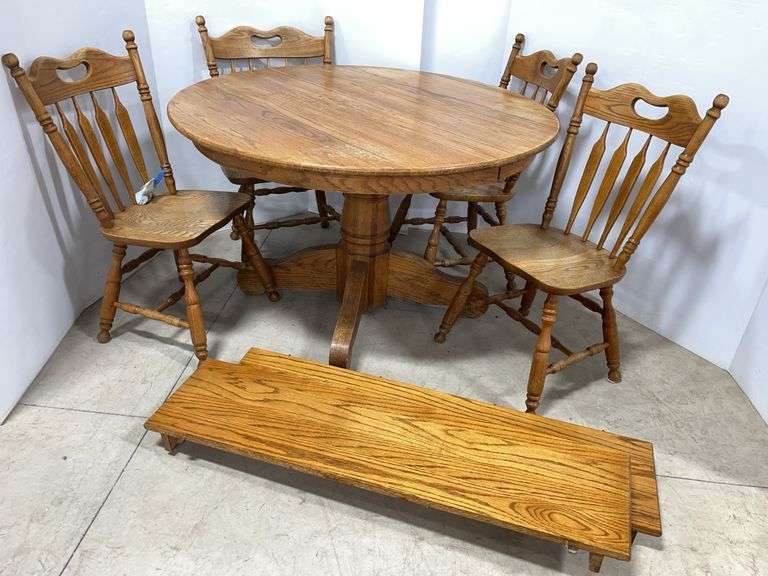 Dining room table with (2) 11 1/2" leaves, and (4) Chairs, table- 46"Dia x 30"H, some surface wear