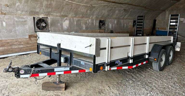 This item Selling ABSOLUTE! ~~~ 2011 Load Trail 18' Skid Steer Trailer, 2' Dovetail with Ramps, 225/75 Load Range E Tires, 6-Lug Wheels, Clean and Clear Title, Fee Weight 2,582 lbs.