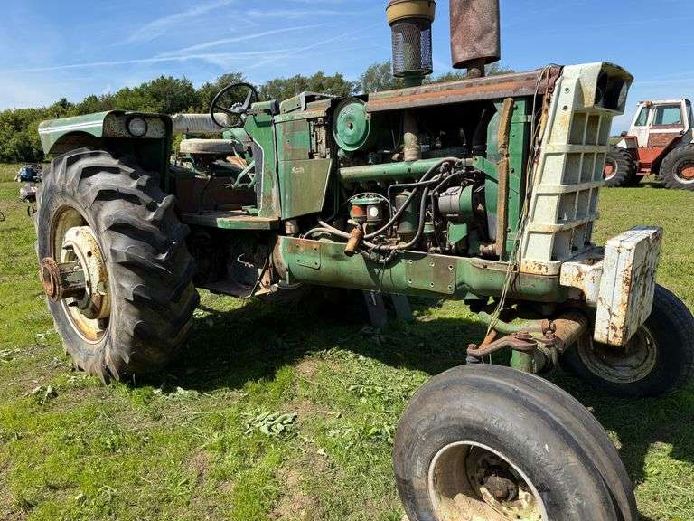 1971 Oliver 1855 Dsl. w.f. Tractor, Ser. No. 229697-685, Over/Under Hydraulic Shift, 3-pt., PTO, Hydraulic Outlet, Front Weights, 18.4-34 Rears, One Dual, Unknown Engine Condition.  Comes with a cab that is located in the woods (see additional pictures).