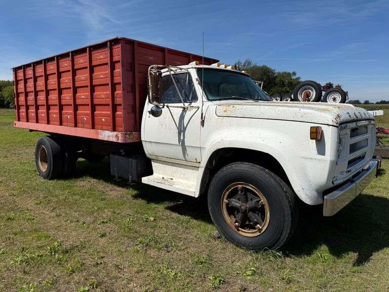 1977 Dodge 600 Single Axle Stake Truck with Hoist, VIN: D61FK7J003802, 16' x 52" Steel Dump Body with Wood Floor, 5-speed/2-speed, 9.00-20 rears (hold air), Is Currently Running