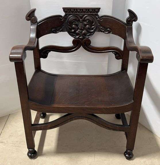 Antique North Wind Victorian Carved Wood Saddle Chair, Partial Label on Bottom of Seat believed to be Stomps and Burkhardt, Throne Chair with Face Carving