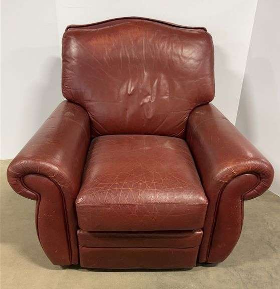 Reclining dark red leather chair, 34"W x 35"H, faded, wear