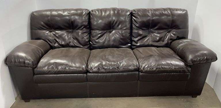 Brown couch, 90"W, some wear, back corners have rips/wear, arm has heavy wear