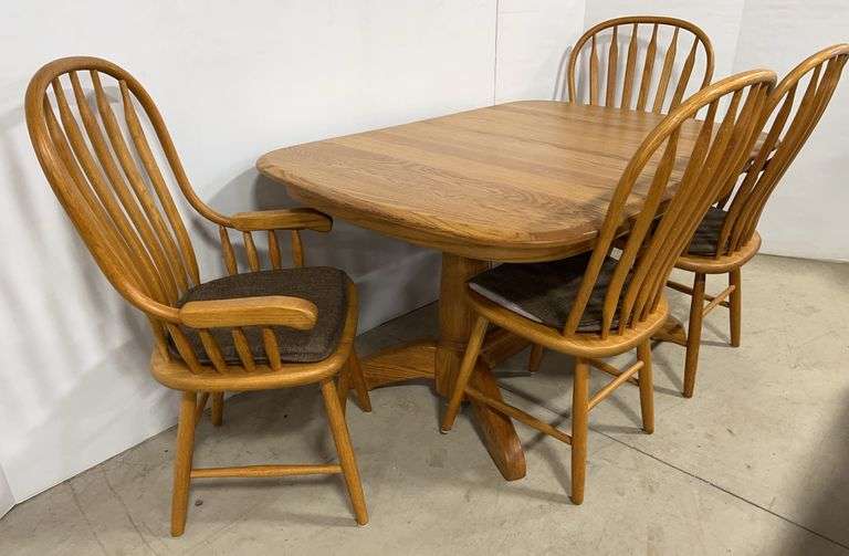 Older oak kitchen table with (2) Leaves, and (4) Chairs, one arm on captain's chair will need some repair, leaves- 12"W, table- 58"W x 40"D x 29"H, nice, used