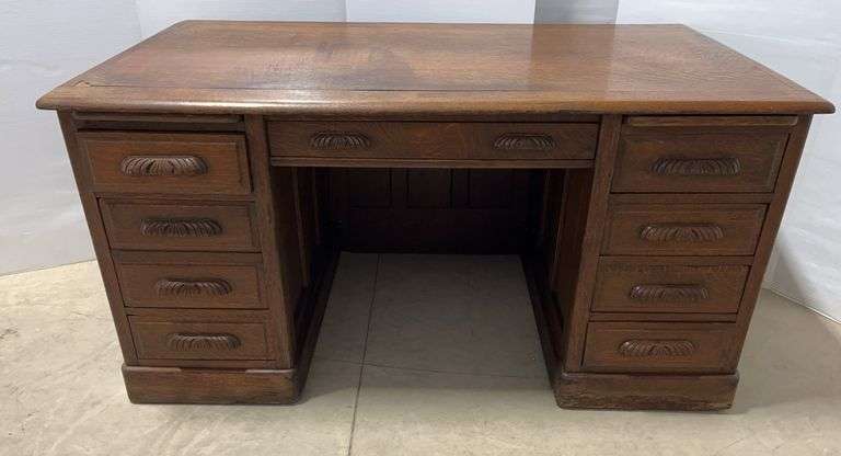Early 1900s oak desk with 8-drawers, finished all the way around, 60"W x 35"D x 37"H, very nice