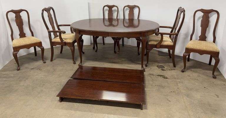 Wooden dining table with (2) Leaves and (6) Chairs, table- 66" x 43" x 29"H, some scratches in spots, one chair leg has chunk broken off bottom