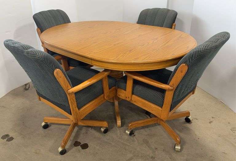 Genuine A America Desoto dining table with removable leaf and (4) Solid oak swivel chairs, solid wood, crafted by the Whittaker Furniture Company, table- 60" x 40", leaf- 18", with leaf- seats six, good, chairs have some fabric wear