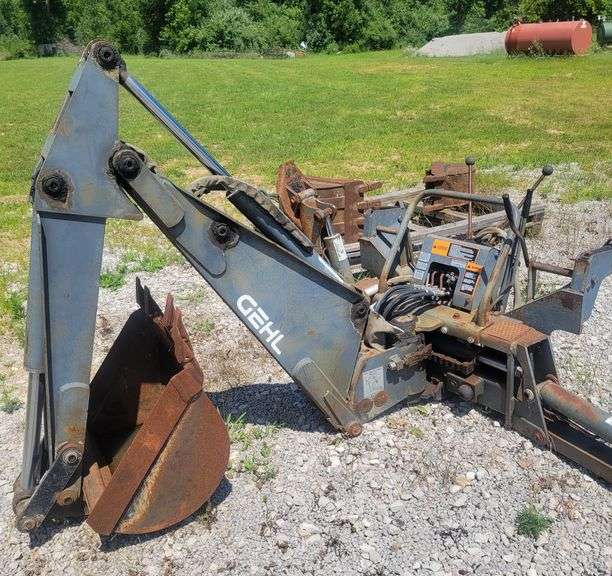 This item Selling ABSOLUTE! ~~~ Heavy Duty Gehl Skid Steer Backhoe with 3-Buckets (12", 18" and 24" Wide with Shanks), Purchased used but Never Used, Hoses Look Good, Stored Mostly Inside