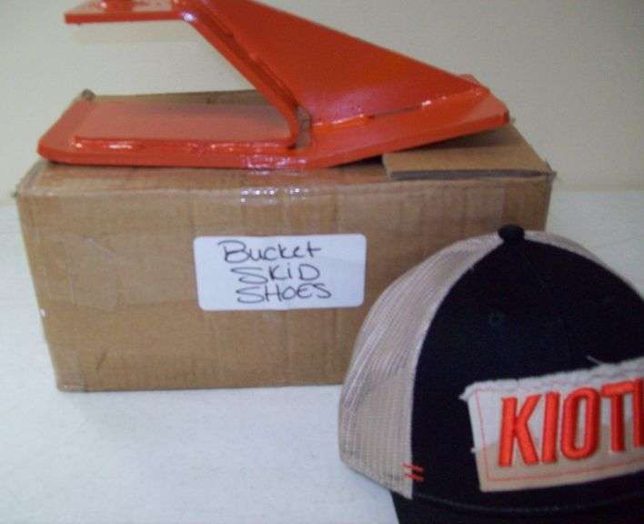 Pair of Bucket Skid Shoes, and a Hat
