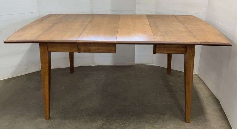 Solid Maple Drop-leaf Dining Table, the table includes (2) 12" leaves as well as a drop leaf on each side of the table, (1) of the leaves does not include an apron