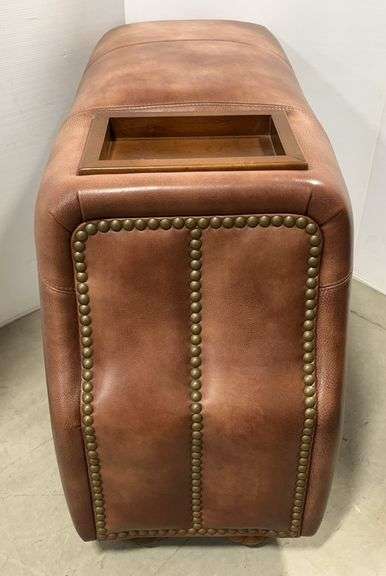 Brown Leather-Upholstered Chairside Console, Designed to Sit Between Two Matching Chairs or Recliners as a Shared Armrest-Height Console, Fully Upholstered with Decorative Nailhead Trim Down the Ends and an Inset Wood Valet Tray on Top, Believed to have Originally Been Part of a Matching Leather Seating Set, Substantial Well-Made Piece