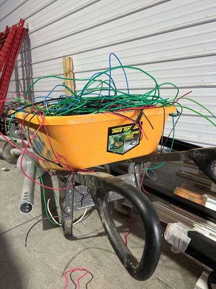 Wheelbarrow full of various cables