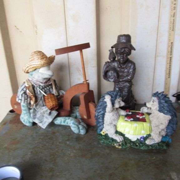 Cloth frog, resin porcupine playing checkers, and boy figure.