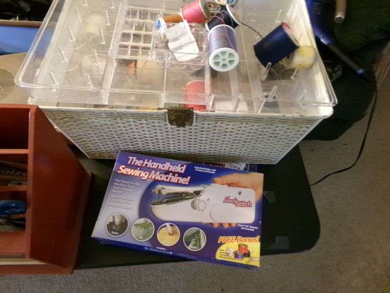 Sewing Box, Handheld Sewing Machine, Scissors, Twine, Alarm Clock And More.