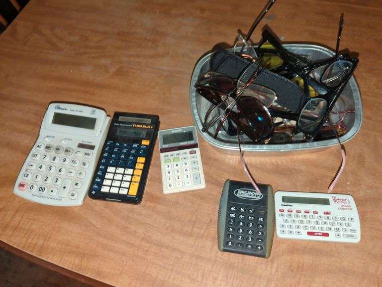 Collection of Various Glasses and Calculators