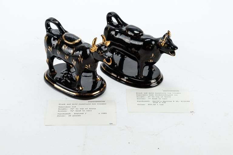 Two Antique Staffordshire Black and Gold Jackfield Cow Creamers