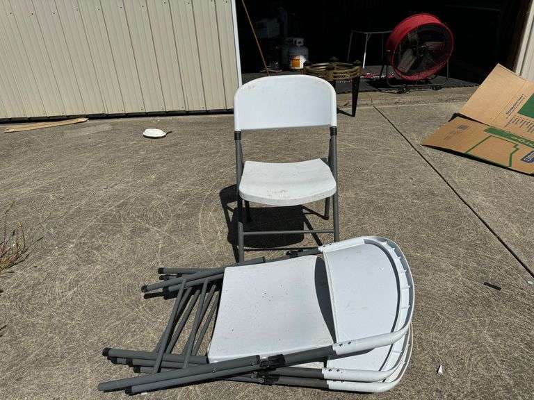 Four (4) Plastic collapsible chairs