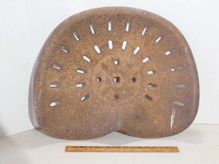 Old Tractor Seat w/surface rust.  Seems solid & not rusted through.  Great wall art or replacement