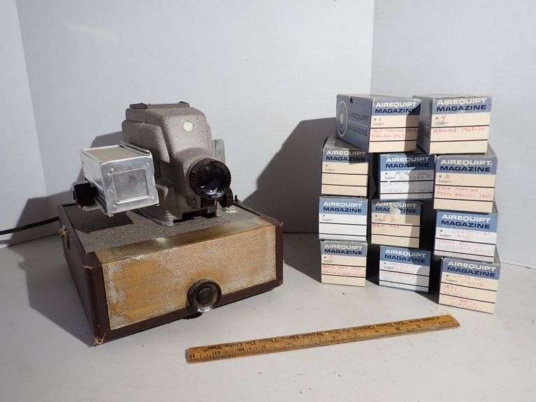 Slide projector & 11 cassettes filled with 1960s slides.