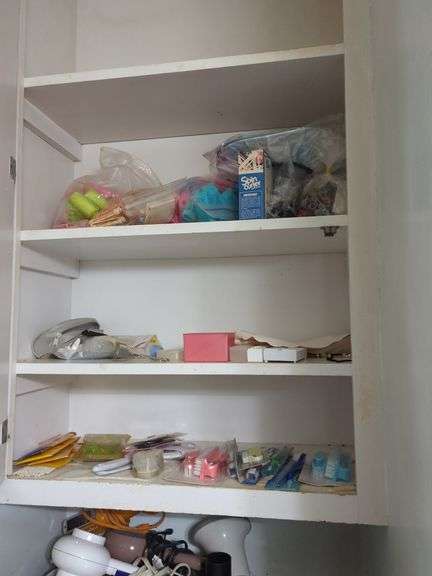 Collection of Various Bathroom Items Including Hairdryers and More