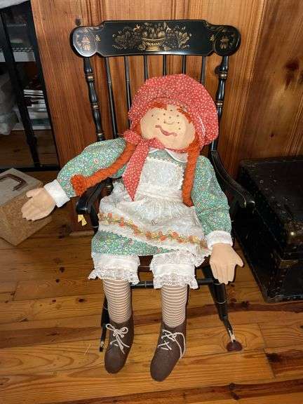 Doll with rocking chair