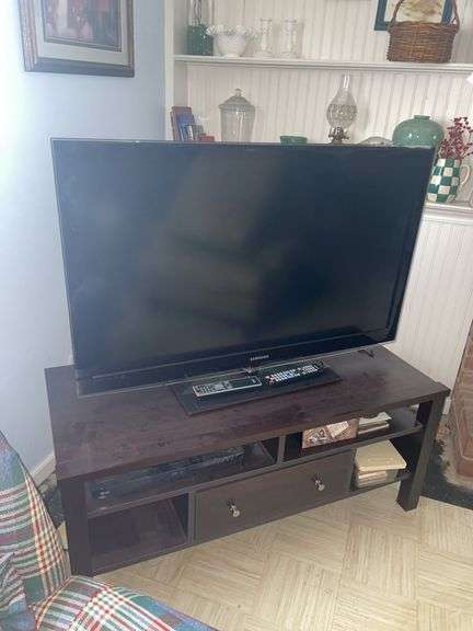 Television, stand and blu-ray