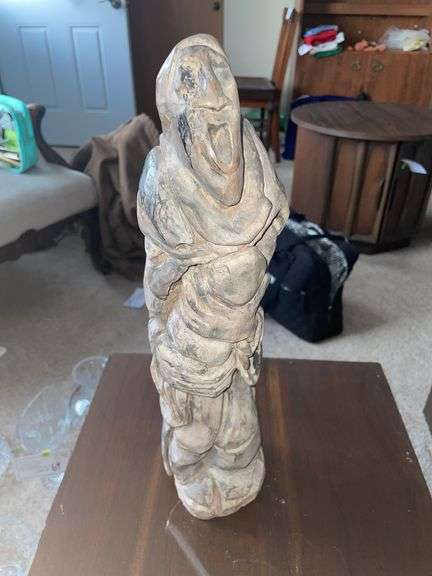 Grotesque sculpture mother and child
