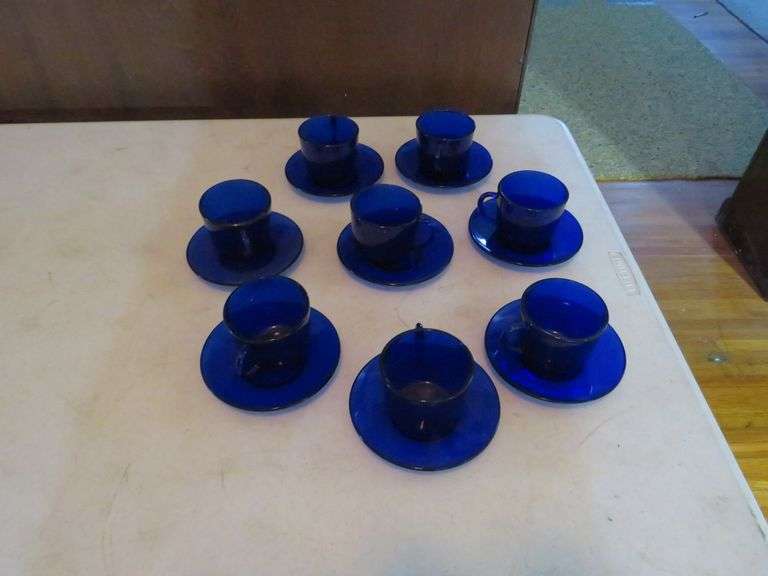 Cobalt blue glass teacups with matching saucers