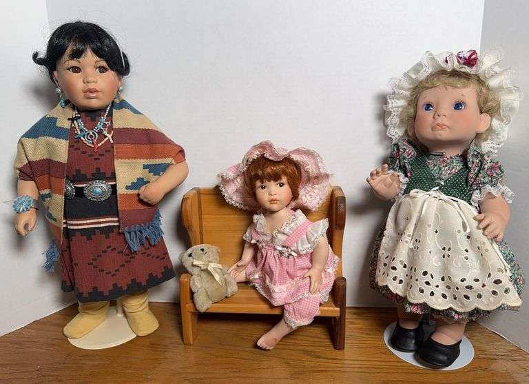 Two Porcelain Dolls and One Vinyl Doll